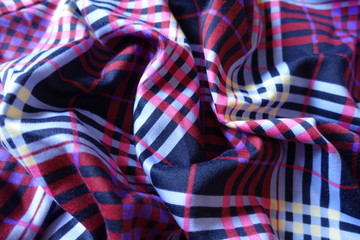 Draped multicolored fabric in shades of violet