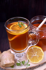 Tea with lemon and mint in a glass