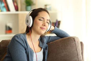 Girl listening and feeling music at home