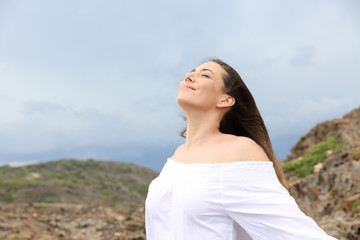 Woman breathing with a storm in the background