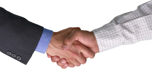 Closeup of Two Businessmen Shaking Hands