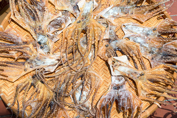 Dried squid on bamboo tray for the ingredients old traditional Chinese Medicine