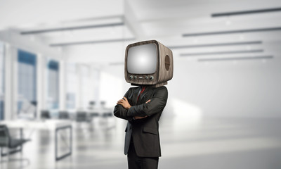 Businessman with old TV instead of head.