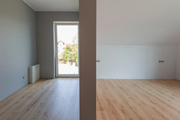 Fototapeta na wymiar Bedroom with new laminated floor in the house