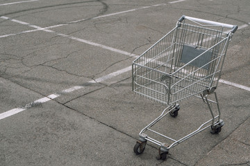 shopping cart without products goods empty on parking slot © PabloStock