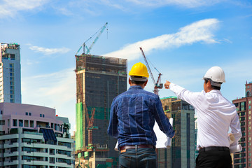 two construction engineer working in construction site and management in the construction site