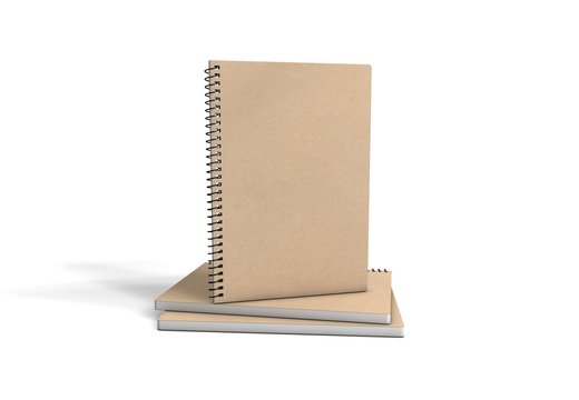 Several recycled paper notebooks isolated on white