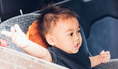 Asian baby boy travel in car seat