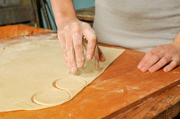 Woman is making pirogi, Ukrainian traditional food 