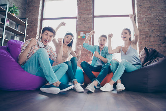 Full Low Angle View Length, Legs, Body, Size And Dynamic Image Portrait Of Youth Guys Victoriously Raising Their Fists Up And Rejoicing At The Beginning Of Summer Vacations Low Angle View