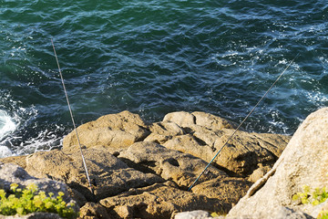 angler fisherman fishing in sea coast