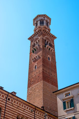 Fototapeta na wymiar Torre dei Lamberti in Piazza delle Erbe, Verona, Italy. It is also known as the -Bell Tower-, built in the 12th century by the Veronese family of Lamberti