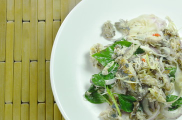 spicy minced mackerel with herb Thai salad on dish
