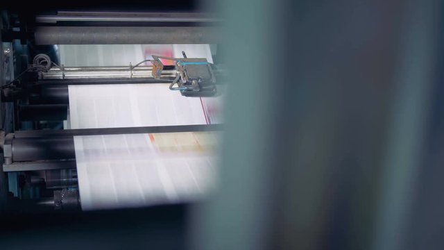 Newspaper printed on a printing house machine. 4K.