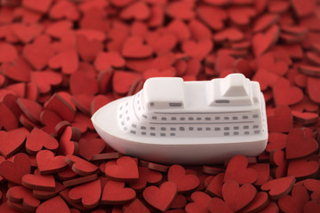 Ship toy on many red hearts