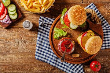 Homemade, beef hamburger with cheese and vegetables.