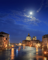 Fototapeta na wymiar The moon shines over Venice. Picture taken from the Academy bridge. Italy.