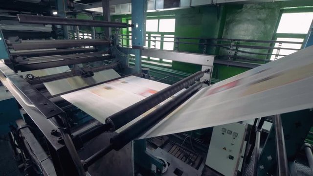 Newspaper printing equipment working. 4K.