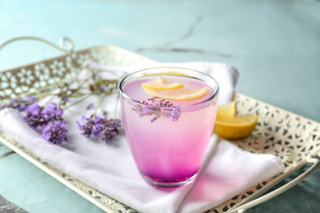 Fototapeta na wymiar Tray with lavender lemonade in glass on table