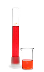 Laboratory glassware with color liquids on white background