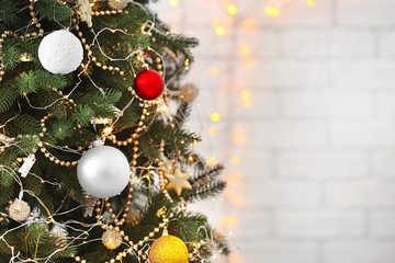 Christmas decorations with glowing lights on fir tree