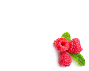 Delicious ripe raspberries with mint on white background