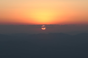 A Beautiful Sunrise on Mountain with red sky background