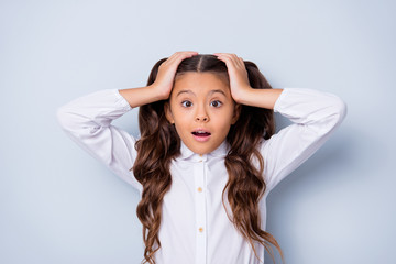Naklejka premium Ready to new school year? Nice cute tender adorable lovely stylish worried girl with curly pigtails in white formal blouse shirt, showing oops gesture. Isolated over grey background