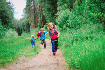 happy kids- boy and girls run to school
