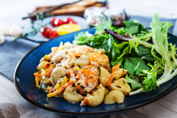 Pasta with vegetables and Shrimps lemon cream basil