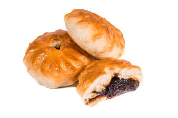 round baked sweet cakes with berry filling inside dark, white background, close-up, bakery,