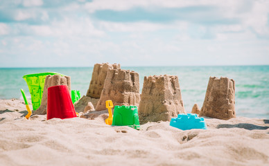 Fototapeta na wymiar Sand castle on the beach, vacation concept
