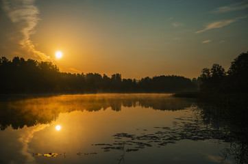 Sunrise over calm lake, Latvia, Kurzeme