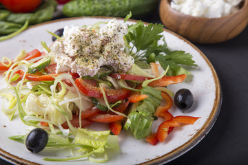 Tasty Greek salad with fresh vegetables, feta cheese and black olives