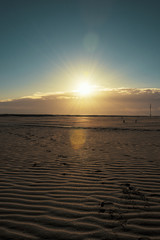 Fototapeta na wymiar Sandy beaches of Rimini shortly after dawn in winter