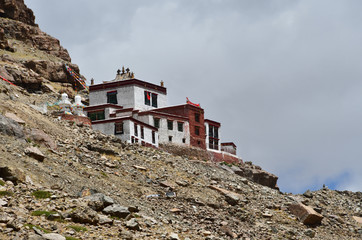 Ancient Buddhist monastery on the mountainside opposite the southern face of mount Kailash...
