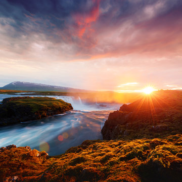 Fototapeta Colorful sunrise on Godafoss waterfall on Skjalfandafljot river, Iceland, Europe