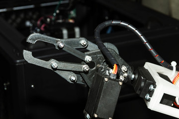 Industrial production robot hand as example of automatization in manufacturing in heavy industry