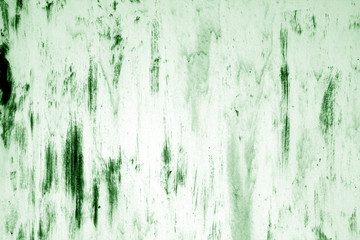 Grungy rusted metal surface in green tone.