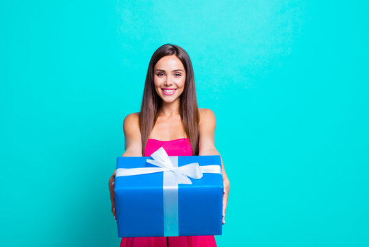 It's for you! Close up studio photo portrait of charming cute nice attractive confident girl holding big giftbox in hands isolated on bright blue background copy space