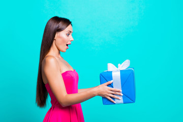 Is it for me? Half faced turned attractive with open mouth pretty amazed cheerful funny funky joyful lady taking big expensive present isolated on bright vivid background copy space