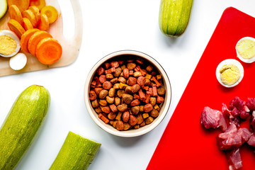 Set of animal food, meat,vegetables and eggs on kitchen top view