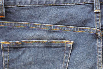 The back pocket of the blue jeans.