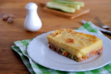 Portion of shepherd's pie, a traditional British casserole with mashed potatoes, meat and vegetables.