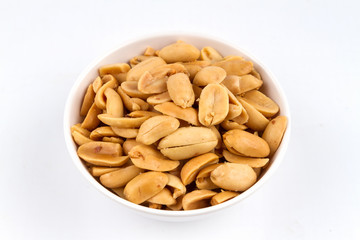 Peeled salted peanuts on white background