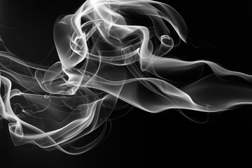 Smoke the white incense on a black background