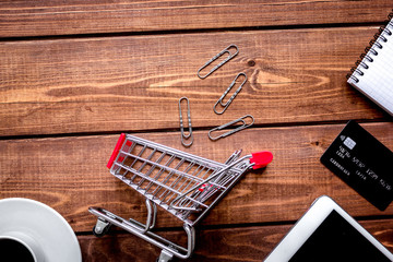 concept online shopping with smartphone on wooden background moc