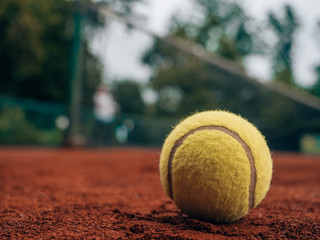 playing tennis on clay court