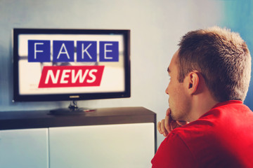 lies of tv propaganda mainstream media disinformation, A fake news report. viewer is watching TV...