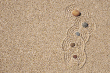 sea stones and patterns on the sand